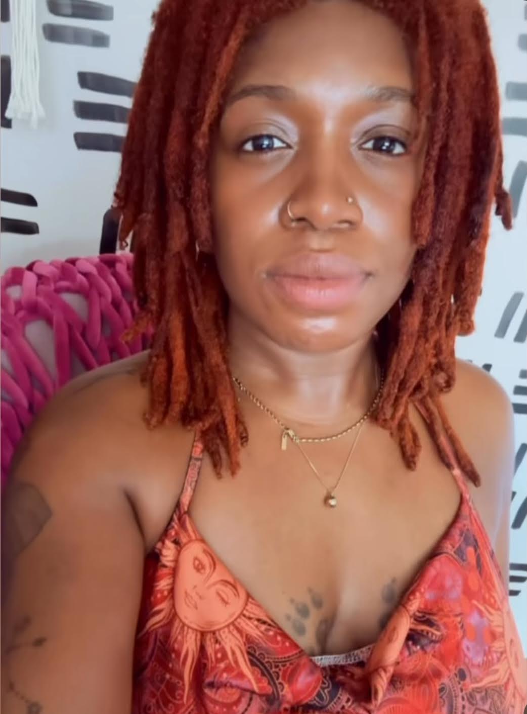 Portrait of a Black woman in a warm, welcoming setting.